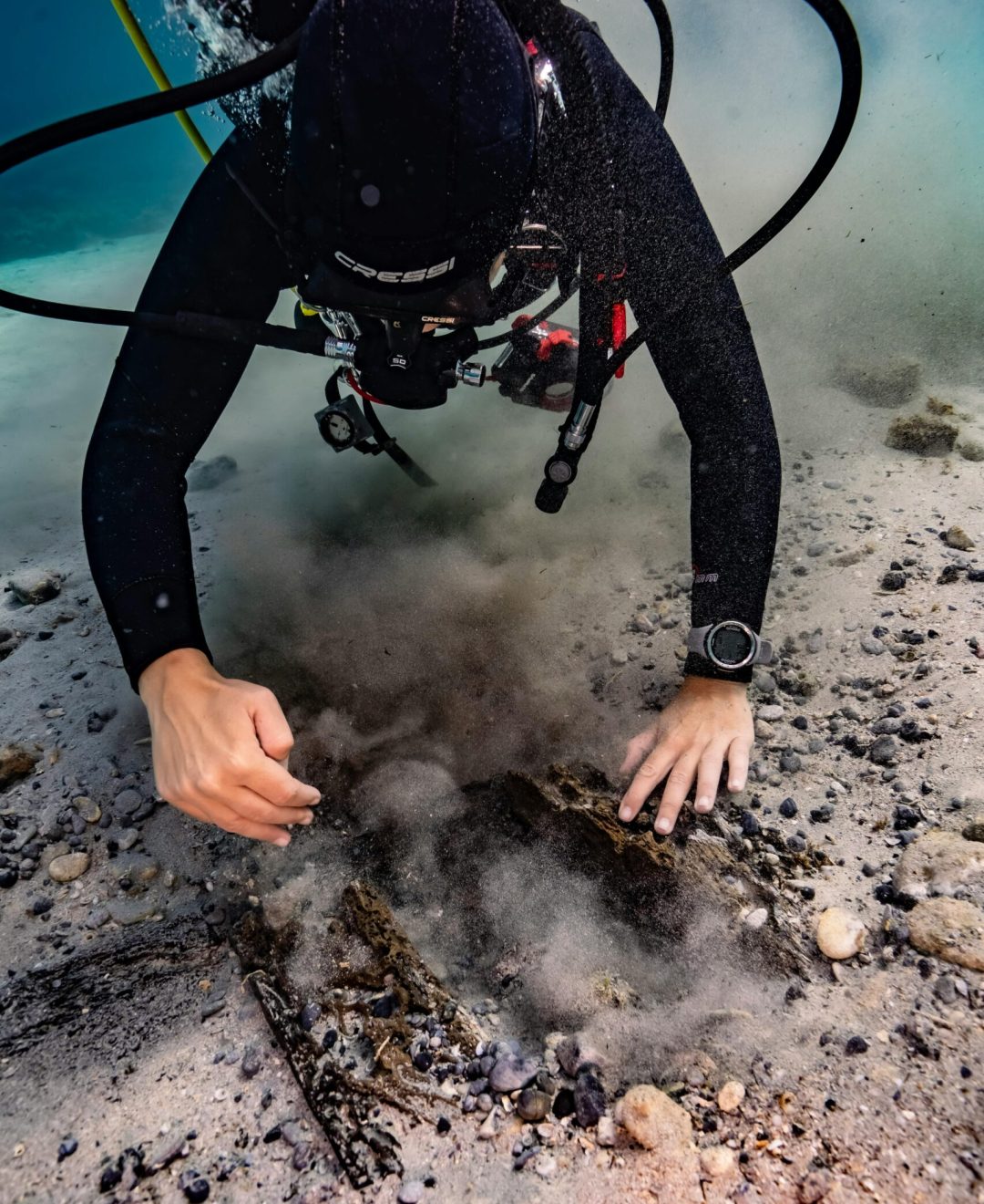 Diver exploring seabed in Croatia, discovering marine life in a vibrant underwater environment.